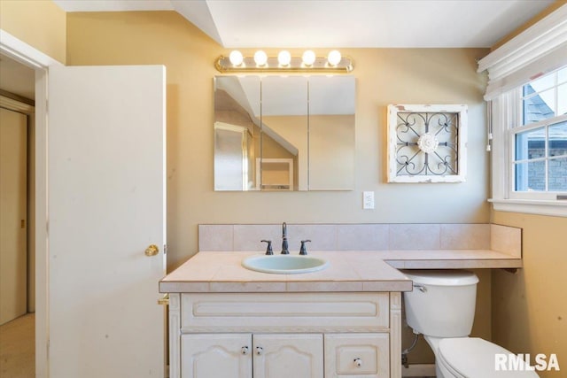 bathroom with toilet and vanity