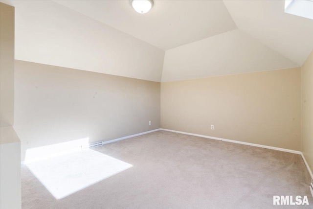 additional living space with lofted ceiling, carpet flooring, and baseboards