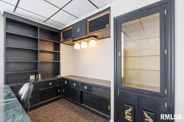 office featuring dark wood-style floors and a drop ceiling