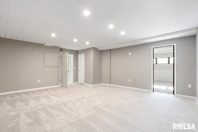 below grade area featuring recessed lighting, visible vents, baseboards, and light colored carpet