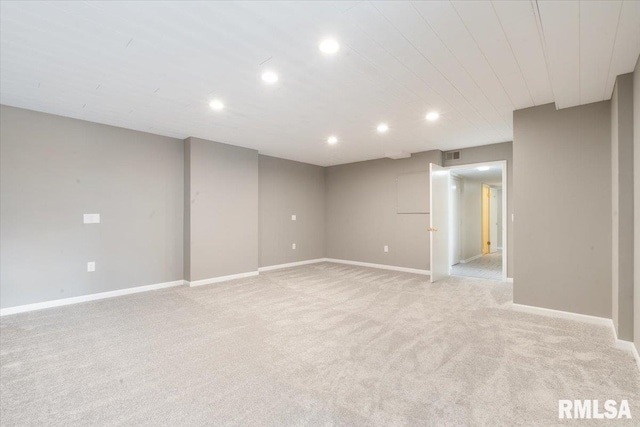 finished below grade area with recessed lighting, light colored carpet, visible vents, and baseboards