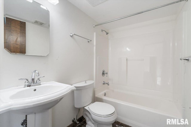 bathroom with bathing tub / shower combination, toilet, visible vents, and a sink