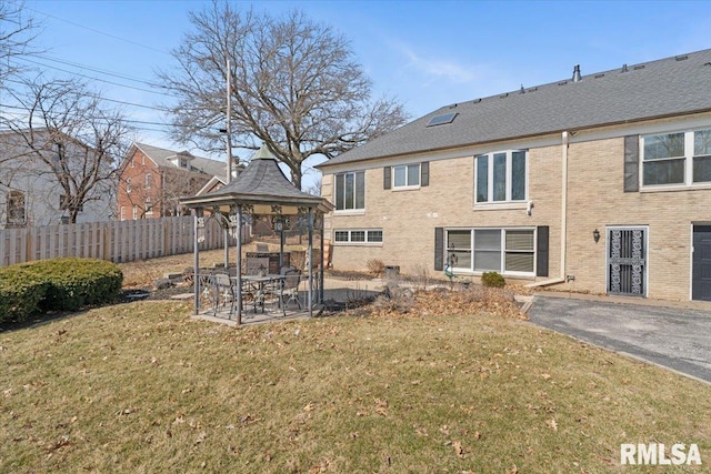 view of yard with a gazebo and fence