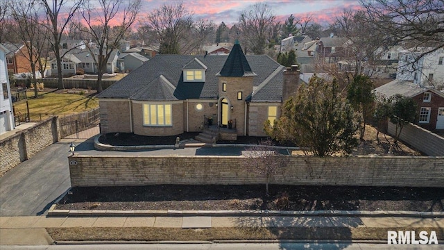 view of front of property with a fenced front yard and a residential view