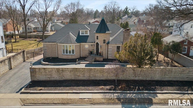 view of front of house featuring a residential view and fence