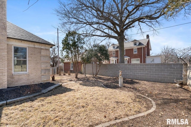 view of yard featuring fence