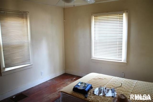 1836 Cody St, Bettendorf, IA 52722 - bedroom with multiple windows and dark hardwood / wood-style flooring