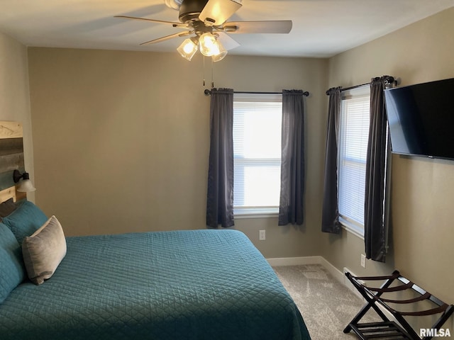 bedroom with ceiling fan and carpet