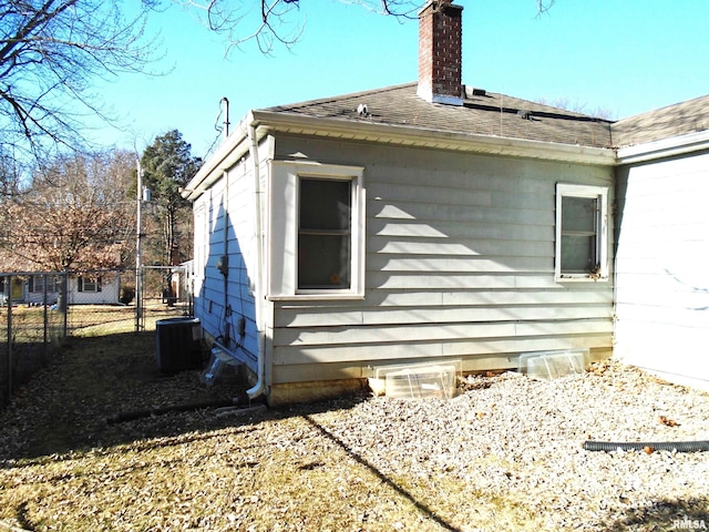 view of side of property featuring central air condition unit