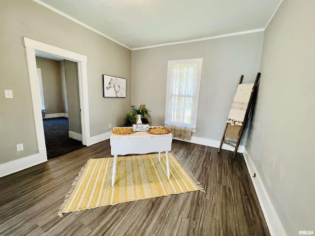 living area featuring crown molding and dark hardwood / wood-style flooring