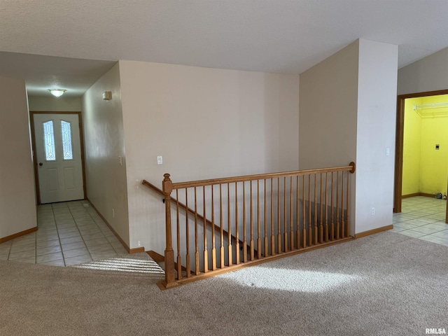 hallway with light tile patterned flooring