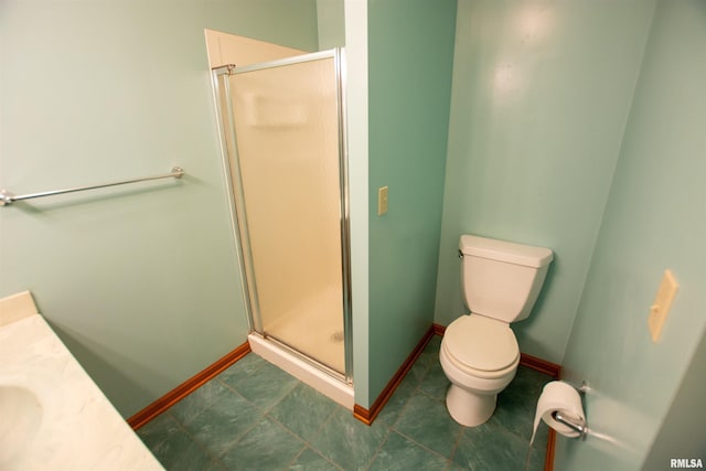 591 Breezy Point Dr, Clinton, IA 52732 - bathroom with a shower stall, toilet, baseboards, and vanity