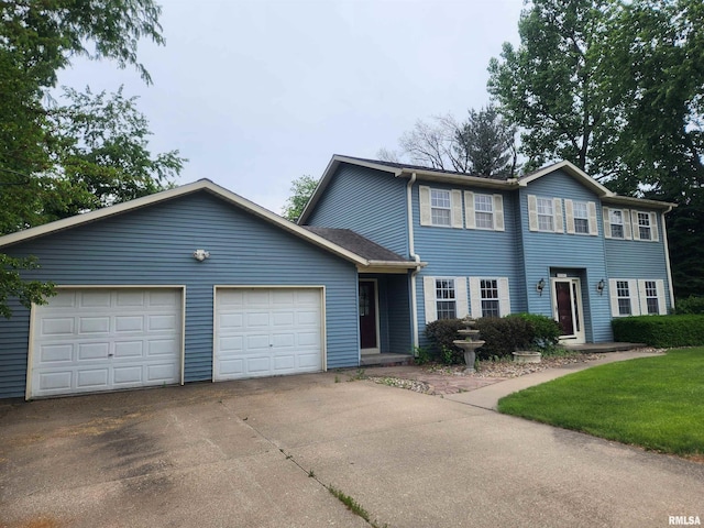 591 Breezy Point Dr, Clinton, IA 52732 - view of front facade featuring driveway and a garage