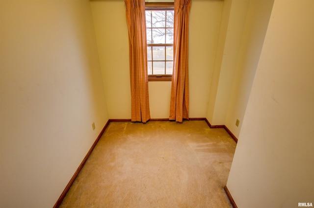 591 Breezy Point Dr, Clinton, IA 52732 - spare room with light carpet and baseboards