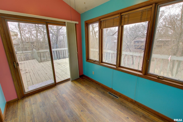591 Breezy Point Dr, Clinton, IA 52732 - unfurnished sunroom featuring lofted ceiling