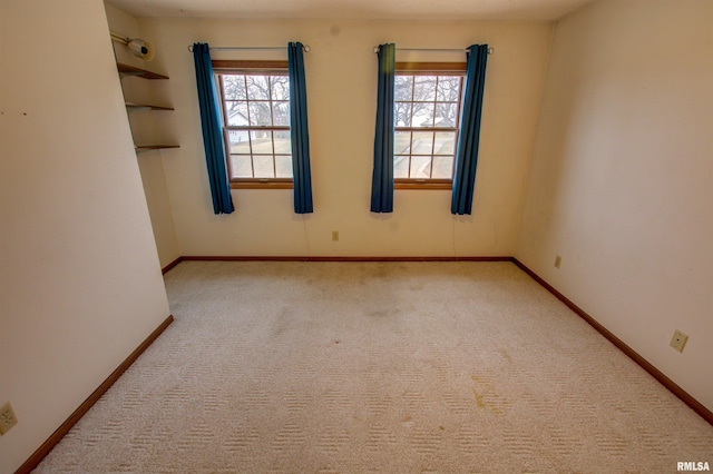 591 Breezy Point Dr, Clinton, IA 52732 - carpeted empty room with baseboards