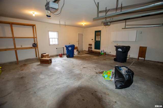 591 Breezy Point Dr, Clinton, IA 52732 - garage featuring a garage door opener