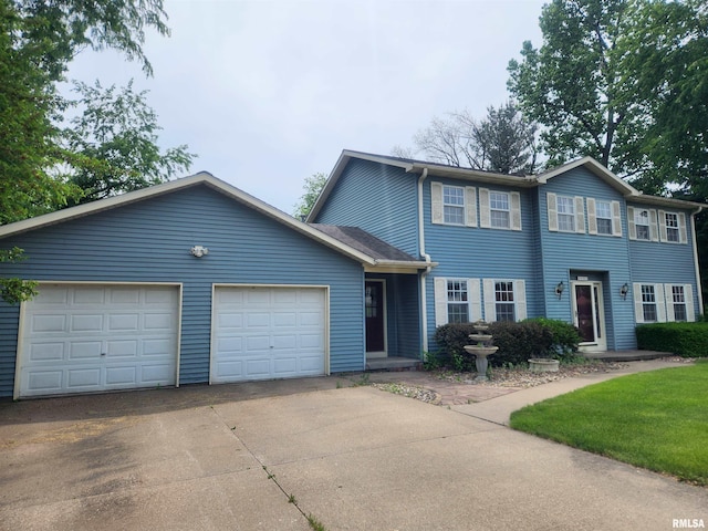 591 Breezy Point Dr, Clinton, IA 52732 - view of front facade featuring driveway and an attached garage