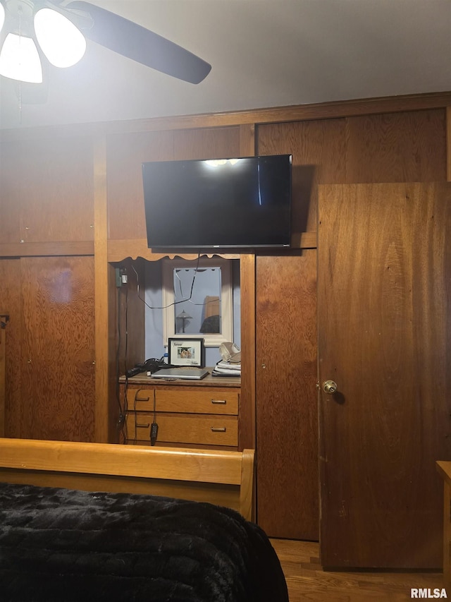 bedroom with wood-type flooring and ceiling fan