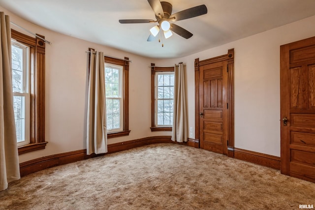 unfurnished bedroom featuring carpet flooring and ceiling fan