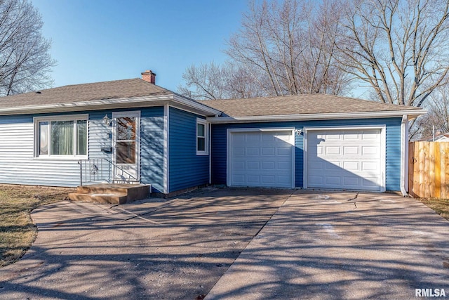 ranch-style house featuring a garage