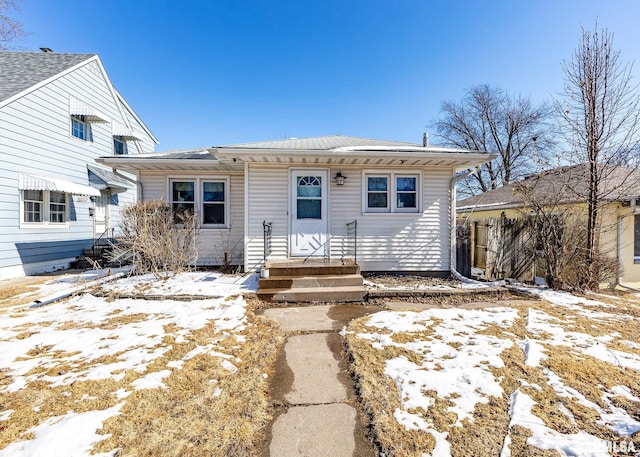 view of front of home featuring fence