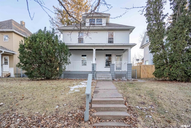 view of front of house featuring a porch and a front yard