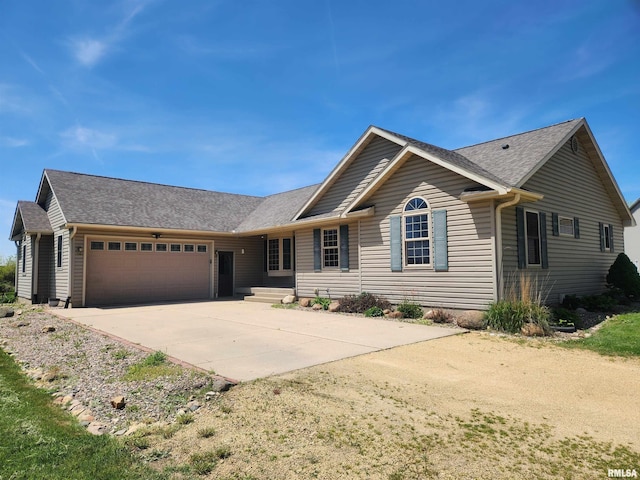 2260 260th Ave, De Witt, IA 52742 - ranch-style house with an attached garage, concrete driveway, and a shingled roof