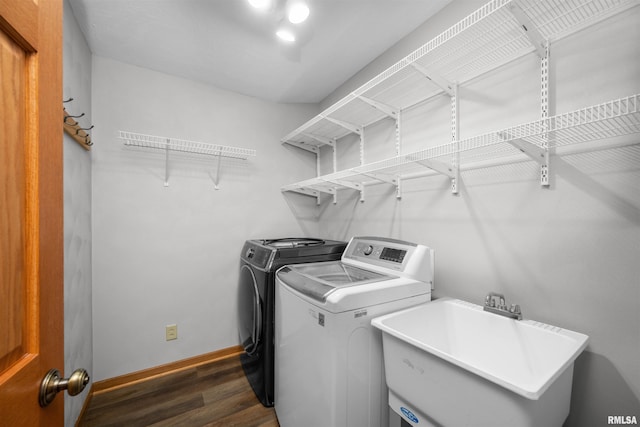 2260 260th Ave, De Witt, IA 52742 - laundry area with washer and clothes dryer, dark wood finished floors, and baseboards