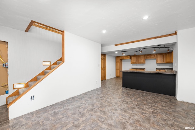 2260 260th Ave, De Witt, IA 52742 - kitchen featuring a peninsula, brown cabinetry, rail lighting, and recessed lighting
