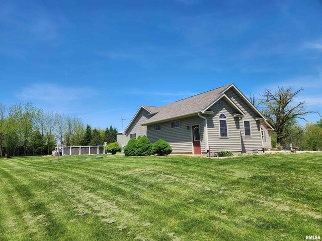 2260 260th Ave, De Witt, IA 52742 - view of home's exterior featuring a lawn