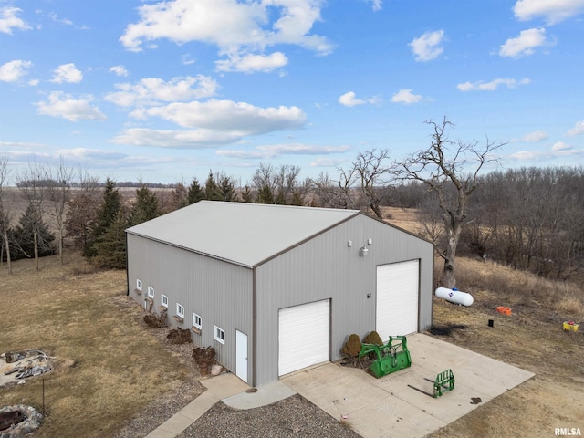 view of outbuilding featuring a garage