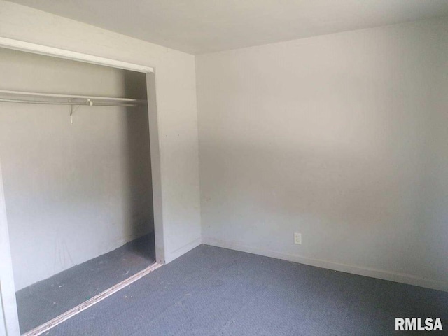 unfurnished bedroom with a closet