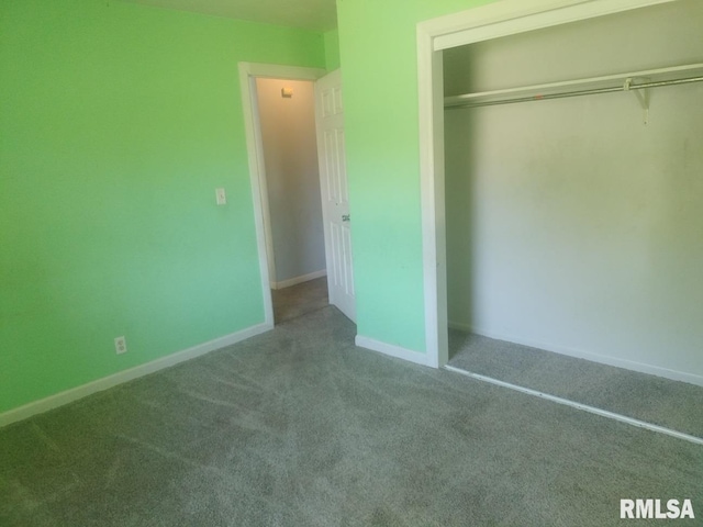 unfurnished bedroom with carpet floors and a closet