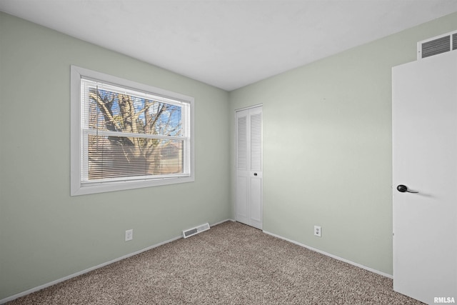 unfurnished room with carpet