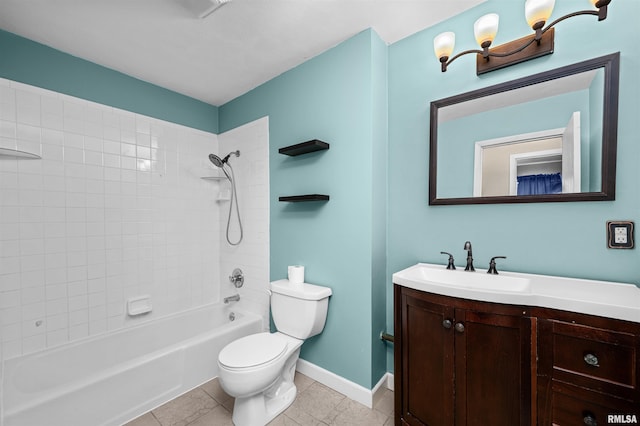 full bathroom featuring vanity, tiled shower / bath combo, tile patterned floors, and toilet