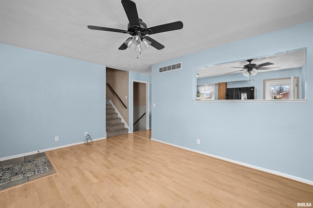 unfurnished room with light wood-type flooring