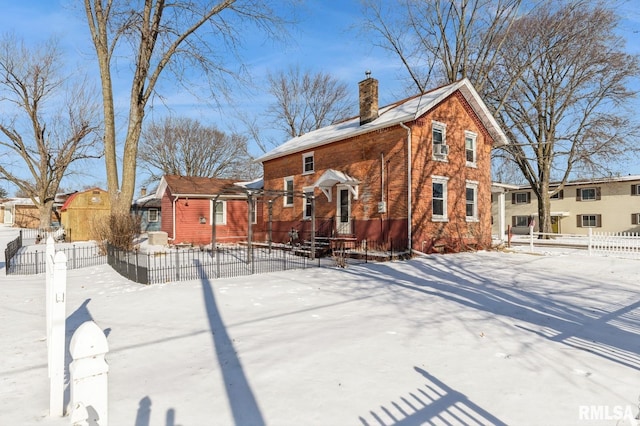 view of snow covered house