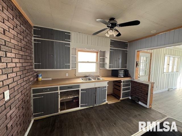 1615 Iowa Ave, Clinton, IA 52732 - kitchen with open shelves, a sink, gray cabinetry, dark wood finished floors, and ceiling fan