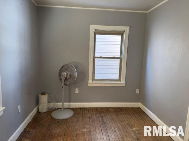 empty room with hardwood / wood-style flooring