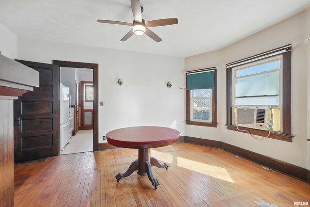 living room featuring carpet floors, built in features, and ceiling fan