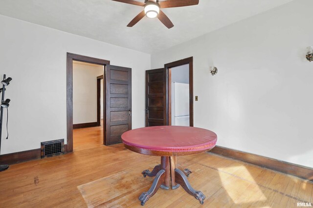 interior space featuring ceiling fan and wood-type flooring