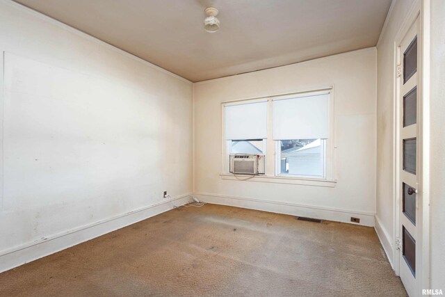 carpeted empty room with wooden walls