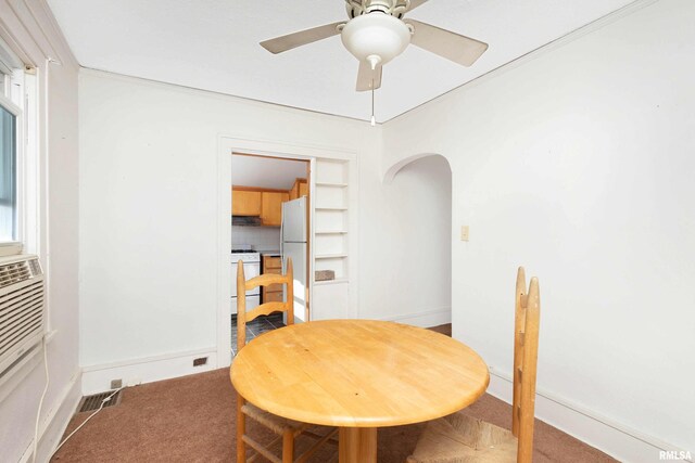 unfurnished bedroom featuring ornamental molding, carpet floors, connected bathroom, and ceiling fan