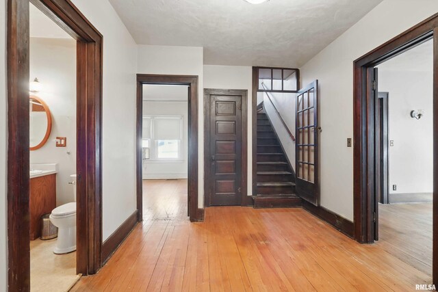 unfurnished living room featuring ceiling fan, carpet floors, built in features, and ornate columns