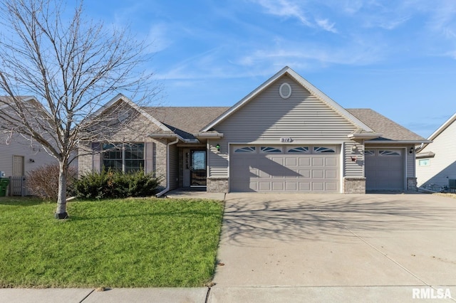 ranch-style house featuring a garage and a front yard