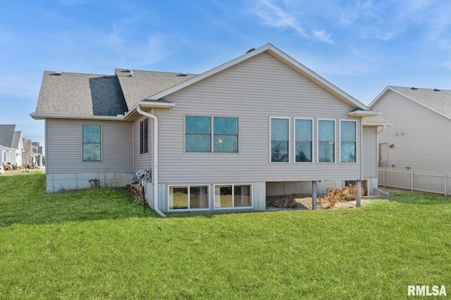 rear view of house with a lawn