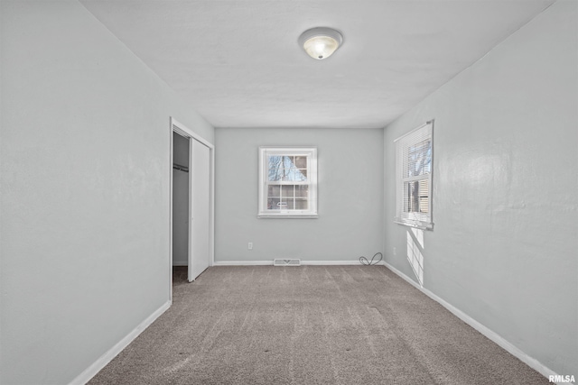 unfurnished bedroom with light carpet