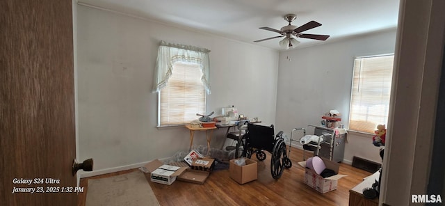 office area with hardwood / wood-style flooring and ceiling fan