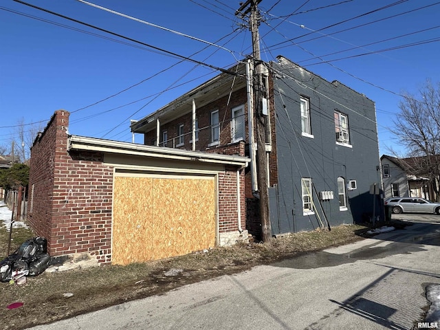 view of side of home with a garage